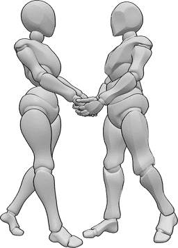 Référence des poses- Pose de flirt en se tenant la main - Une femme et un homme se tiennent debout l'un devant l'autre et se tiennent la main.