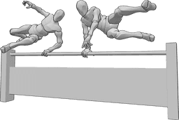 Référence des poses- Sauter par-dessus la pose de la barrière - Deux hommes sautent par-dessus une barrière, en prenant la pose de parkour jumping.