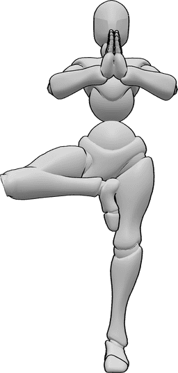 Referencia de poses- Postura de yoga femenina de pie - La mujer está de pie sobre su pierna izquierda y junta las manos