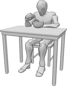Riferimento alle pose- Uomo seduto che mangia in posa - Uomo seduto a tavola che mangia da una ciotola e tiene il cucchiaio nella mano destra