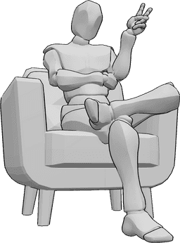 Référence des poses- Homme mignon assis - L'homme est assis dans le fauteuil, les jambes croisées et montre un signe de paix.
