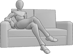 Référence des poses- Position assise confortable sur le canapé - La femme est assise confortablement sur le canapé, les jambes croisées.