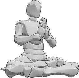Référence des poses- Pose de méditation avec les mains repliées - L'homme est assis sur un coussin et médite, assis avec les genoux sur le sol, pliant les mains.