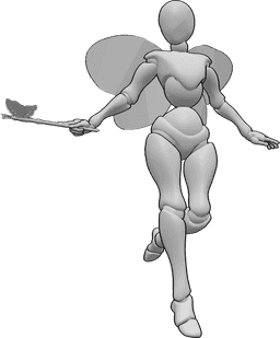 Riferimento alle pose- Posa magica con bacchetta da fata - Fata femmina che vola e lancia un incantesimo con la sua bacchetta fatata