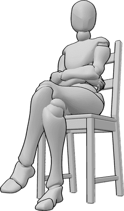 Riferimento alle pose- Posizione delle gambe a braccia incrociate - La donna è seduta con le braccia e le gambe incrociate e guarda a sinistra.