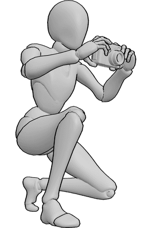 Pose Reference- Camera holding pose - Female is crouching and holding a camera with both hands