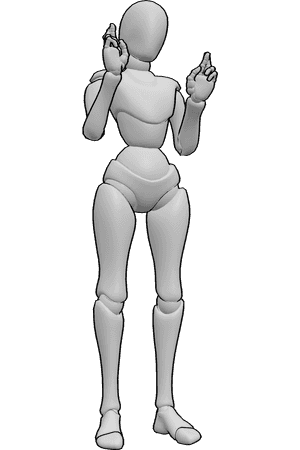 Pose Reference- Crossed fingers hand reference - Female is standing, her index and middle fingers are interlaced