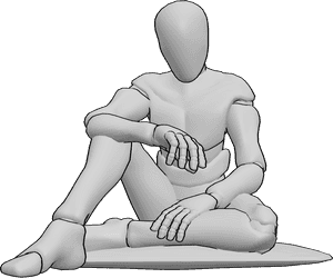 Référence des poses- Homme assis en train d'attendre - L'homme est assis par terre sur un coussin et attend quelque chose en regardant l'heure sur sa montre.